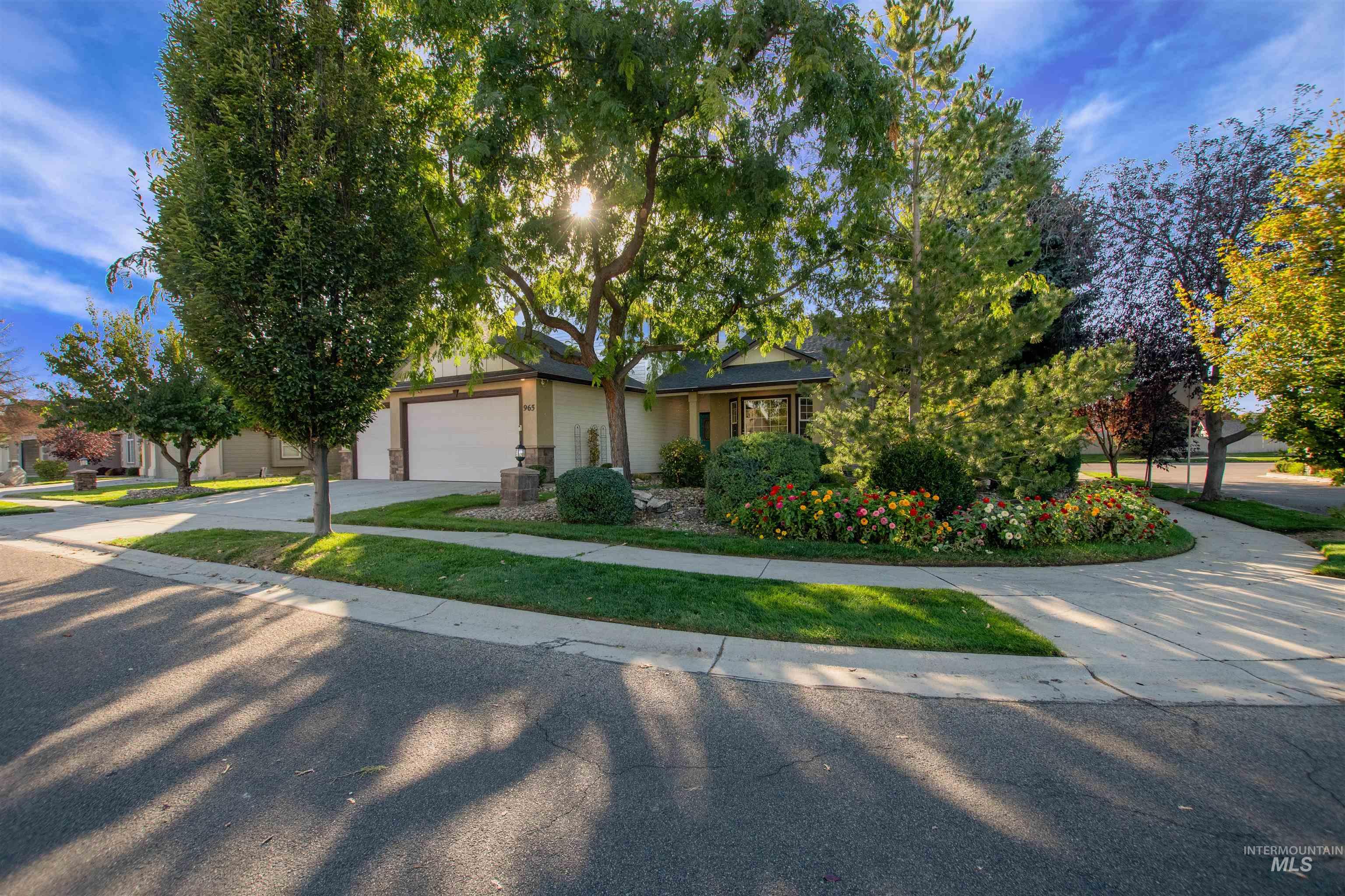 View of front of property featuring driveway and an attached garage