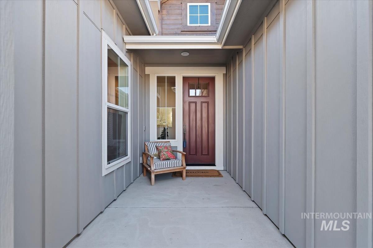 Property entrance featuring board and batten siding
