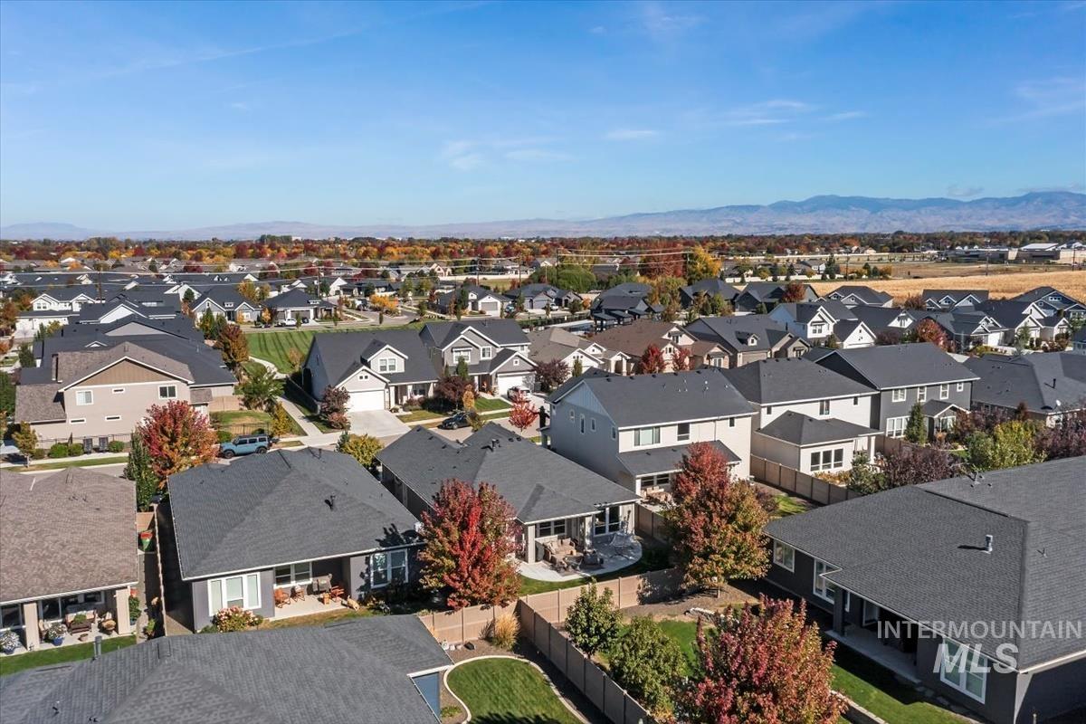 Aerial view of residential area with a mountain backdrop