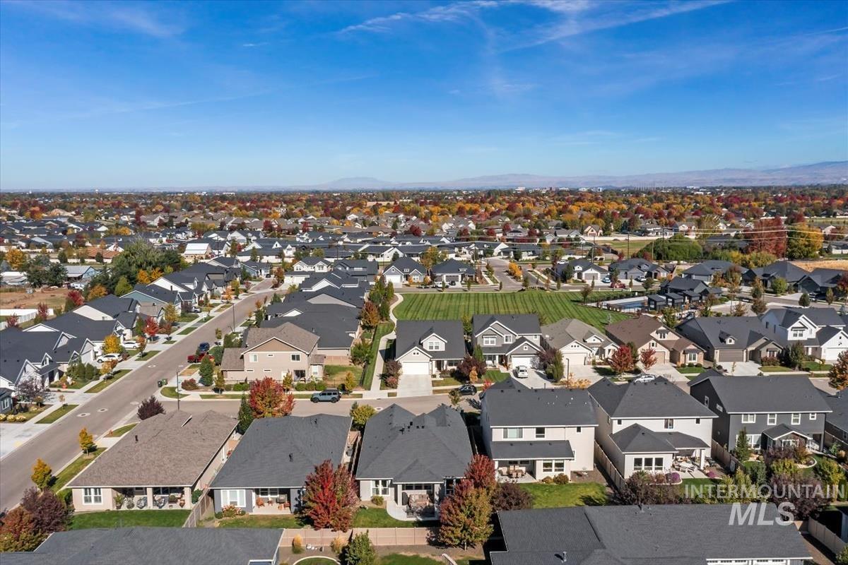 Aerial perspective of suburban area featuring a mountainous background