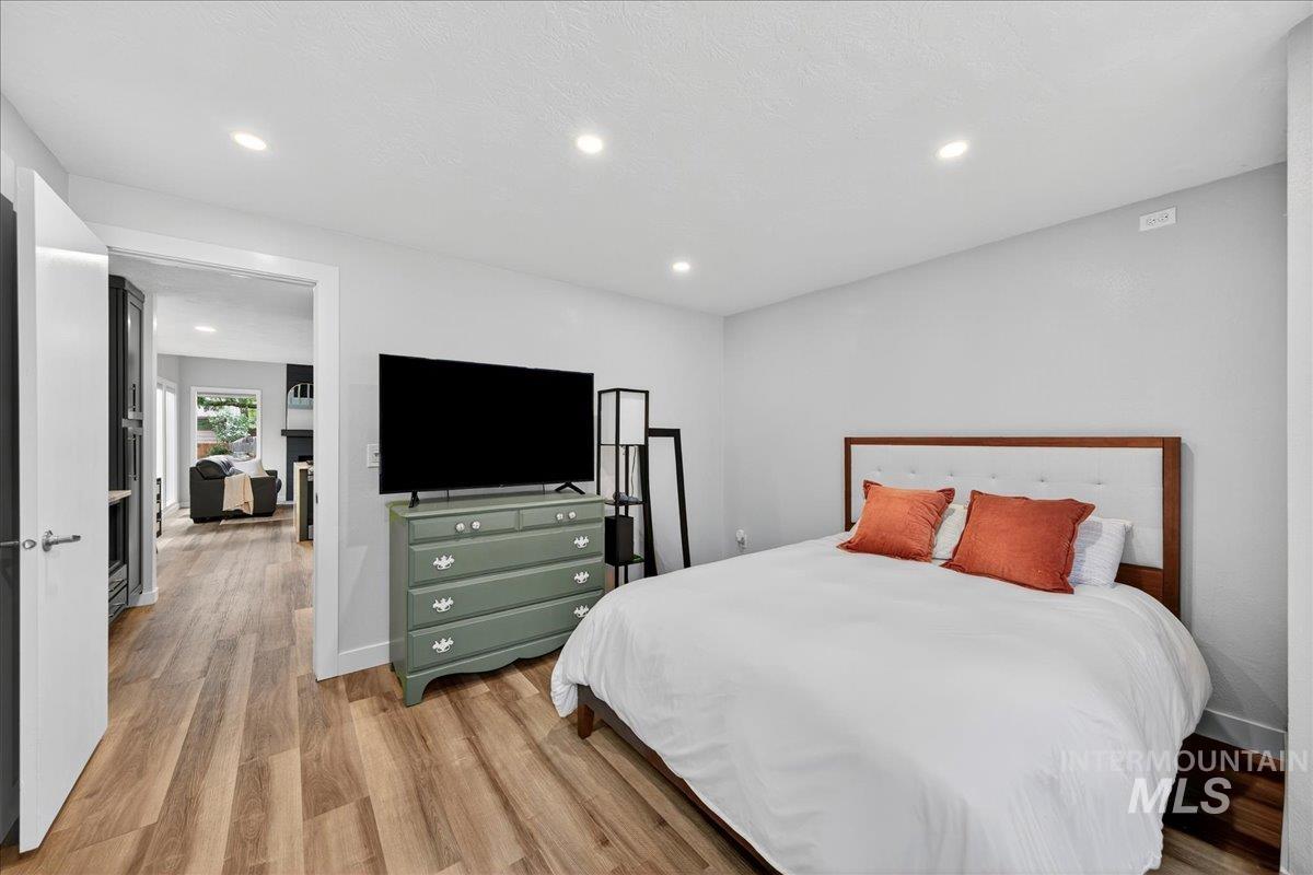Bedroom featuring recessed lighting and light wood-style flooring