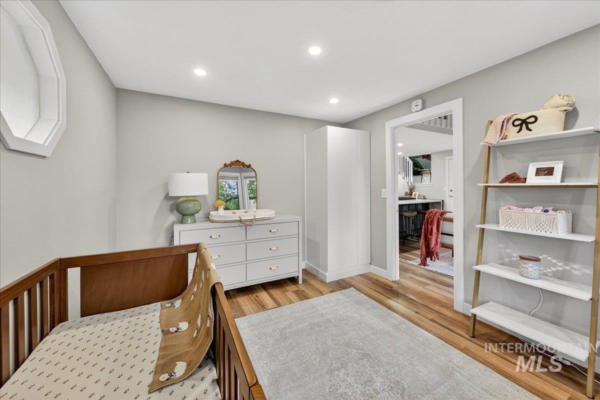Bedroom featuring light wood-type flooring and recessed lighting