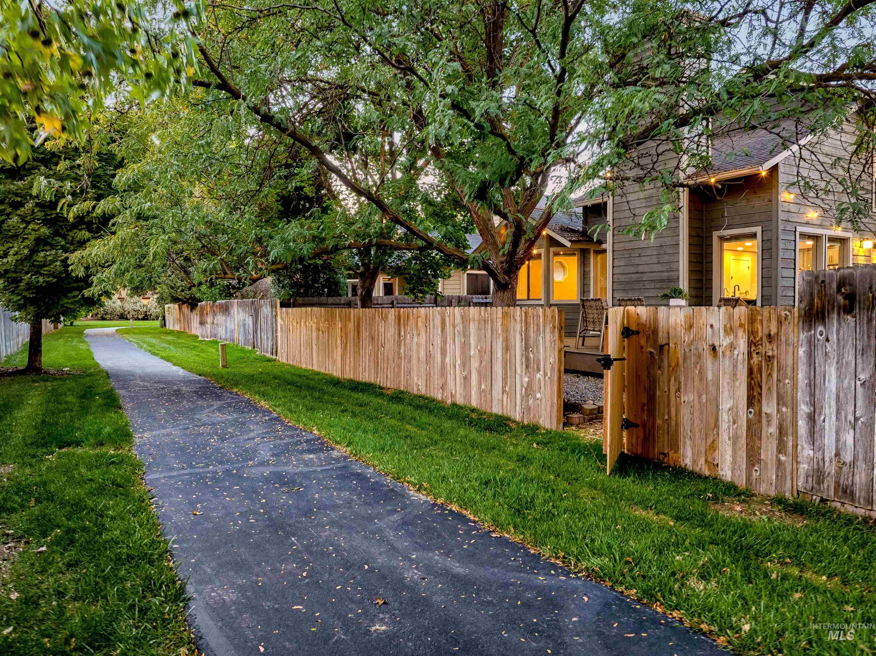 View of home's exterior with a fenced front yard and a gate