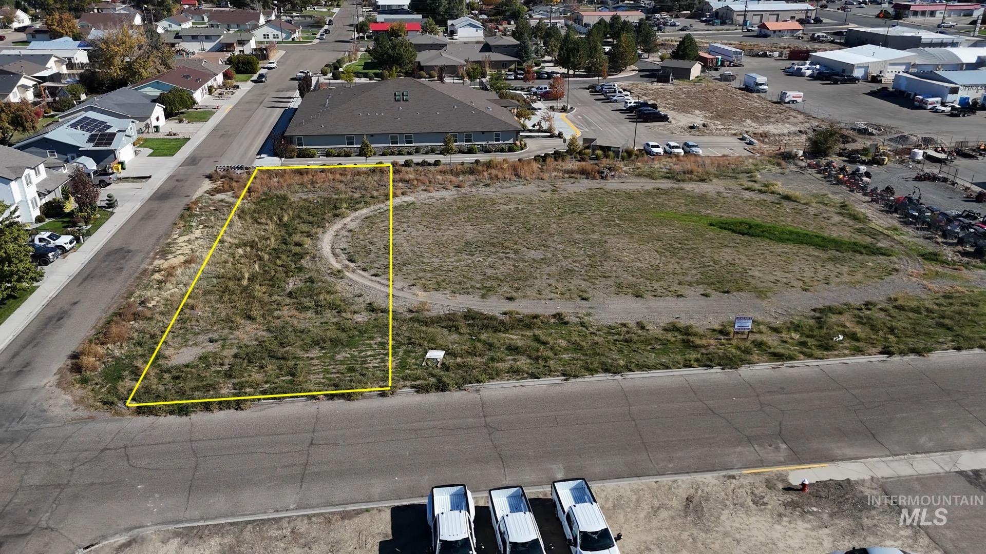 Aerial view of residential area with property boundaries highlighted