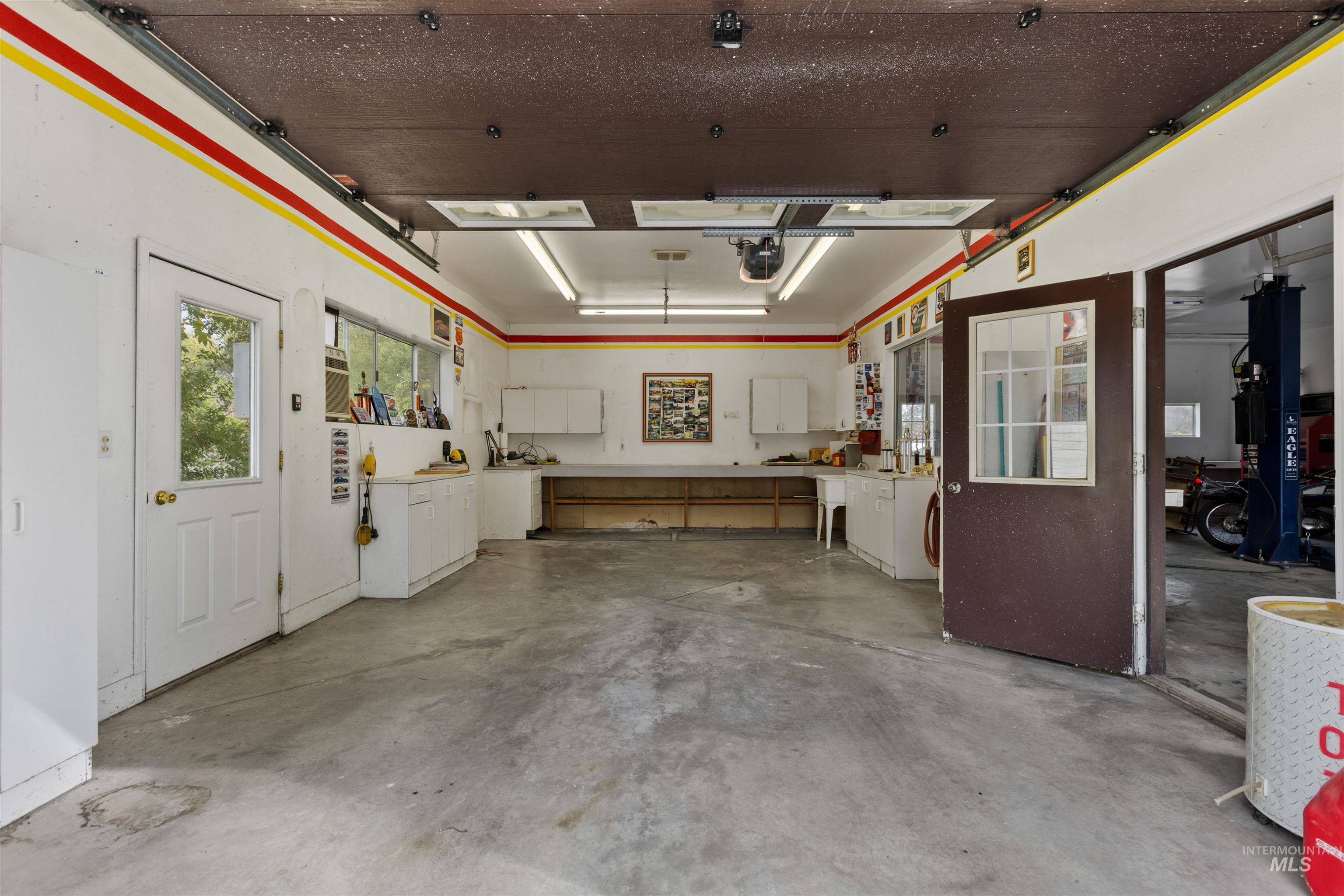 Garage featuring a garage door opener