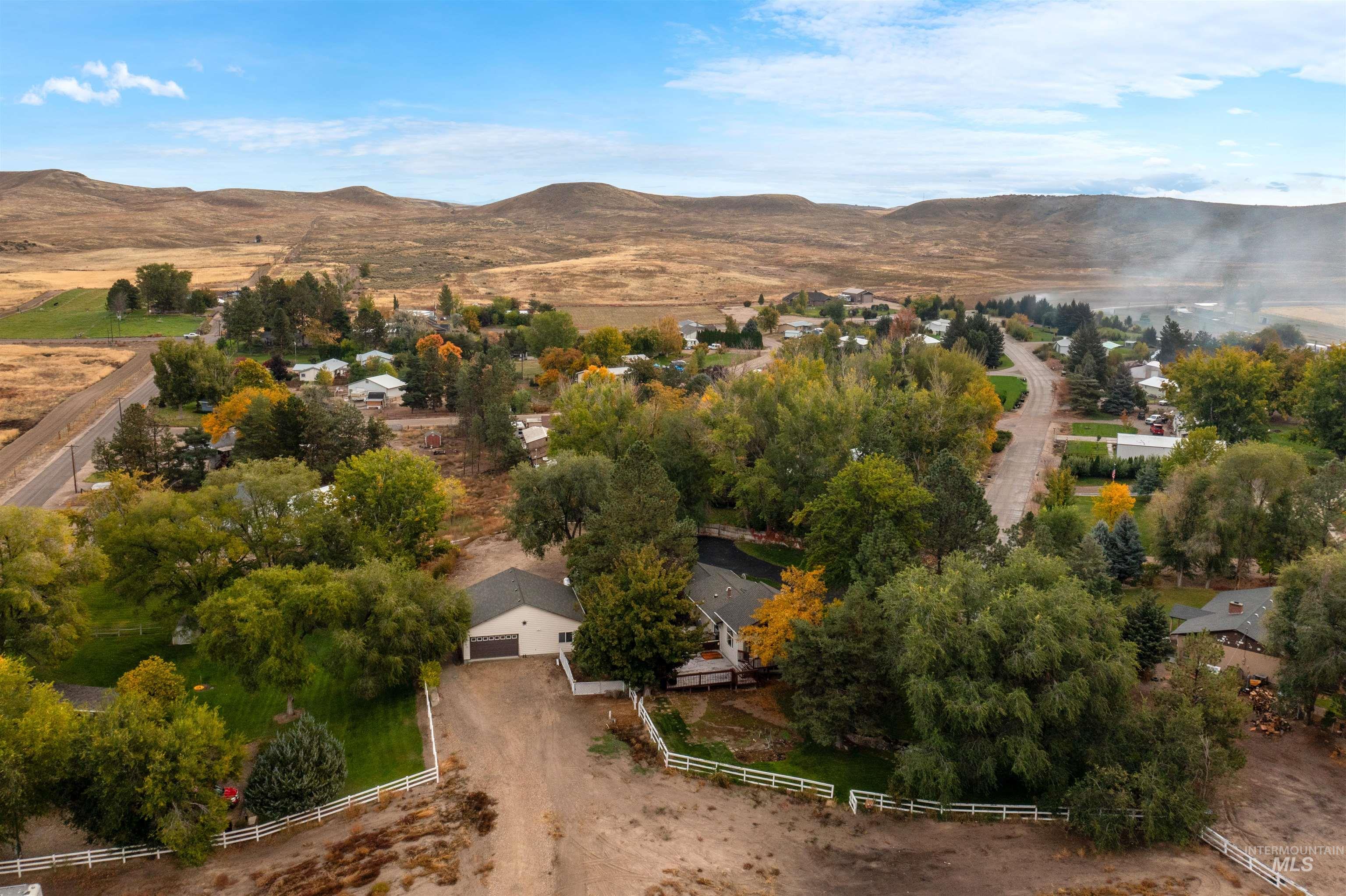 Aerial view of property's location featuring rural landscape and mountains