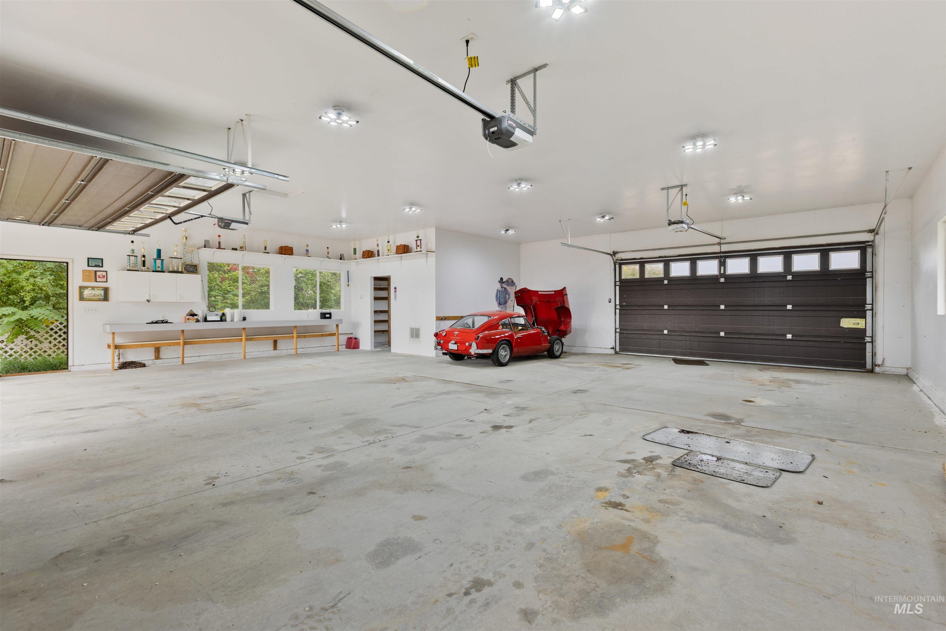Garage featuring a garage door opener