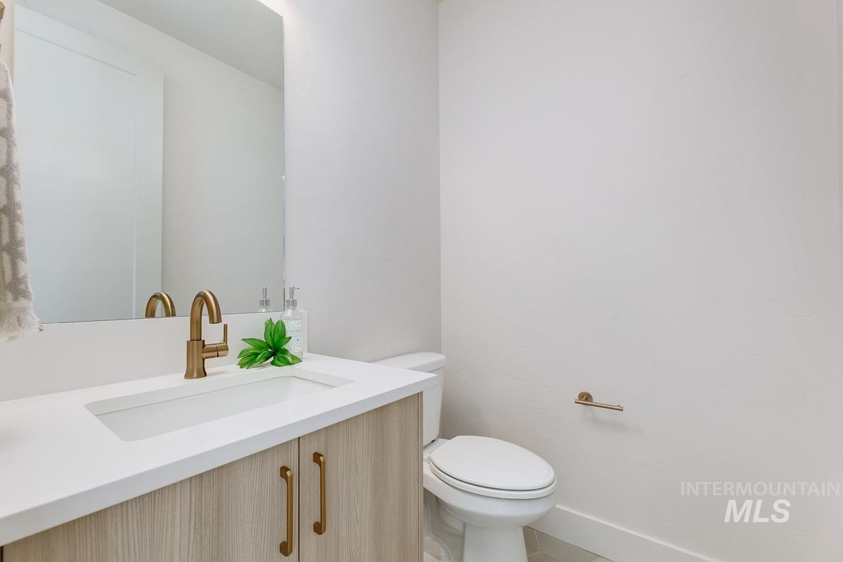 Half bath with vanity and toilet