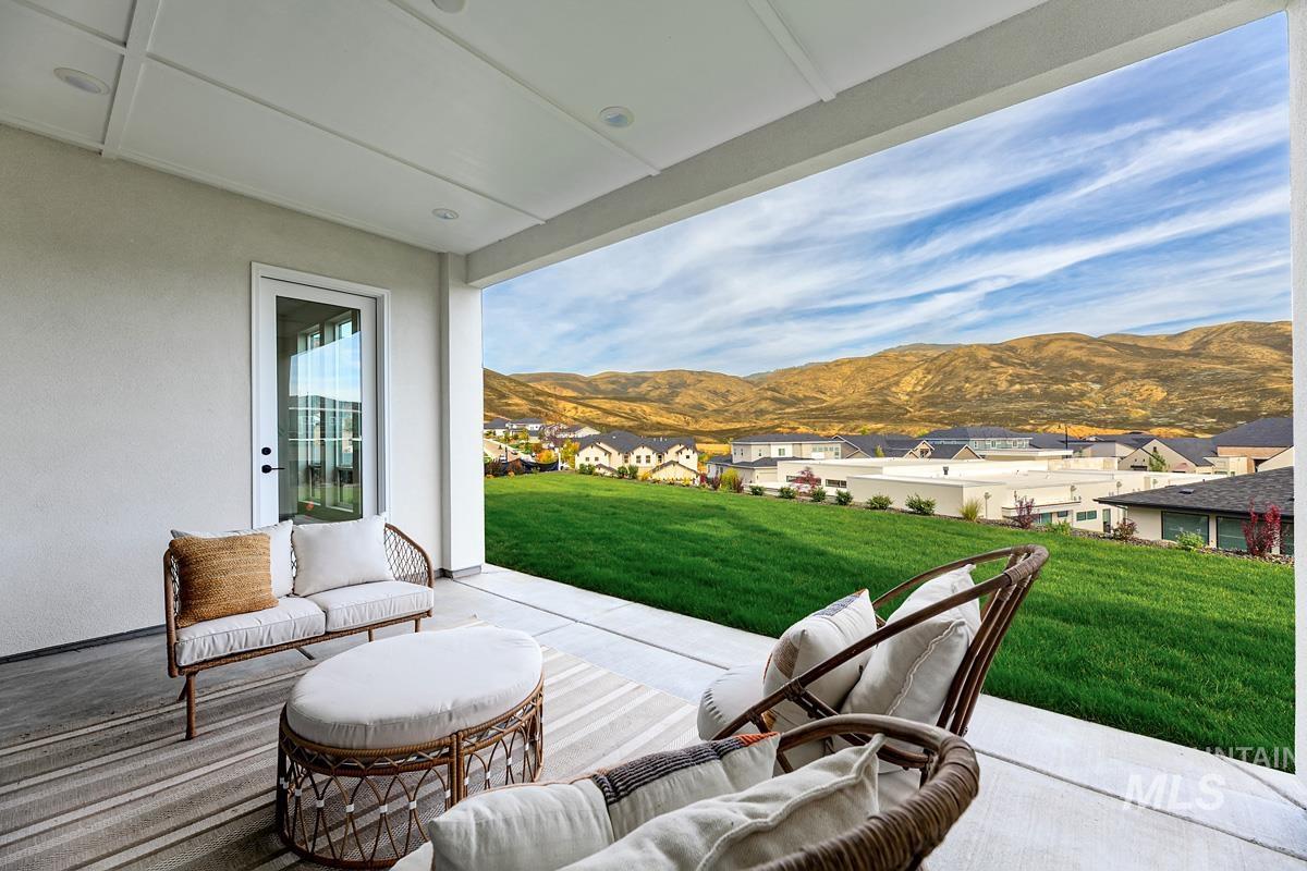 View of patio / terrace with a residential view and a mountain view