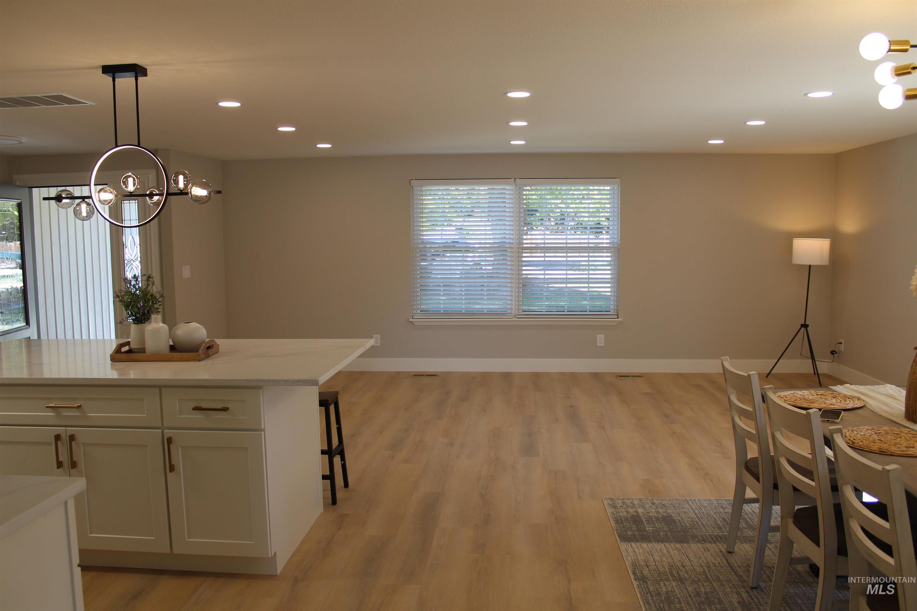 Dining area featuring a chandelier, recessed lighting, and light wood-style floors