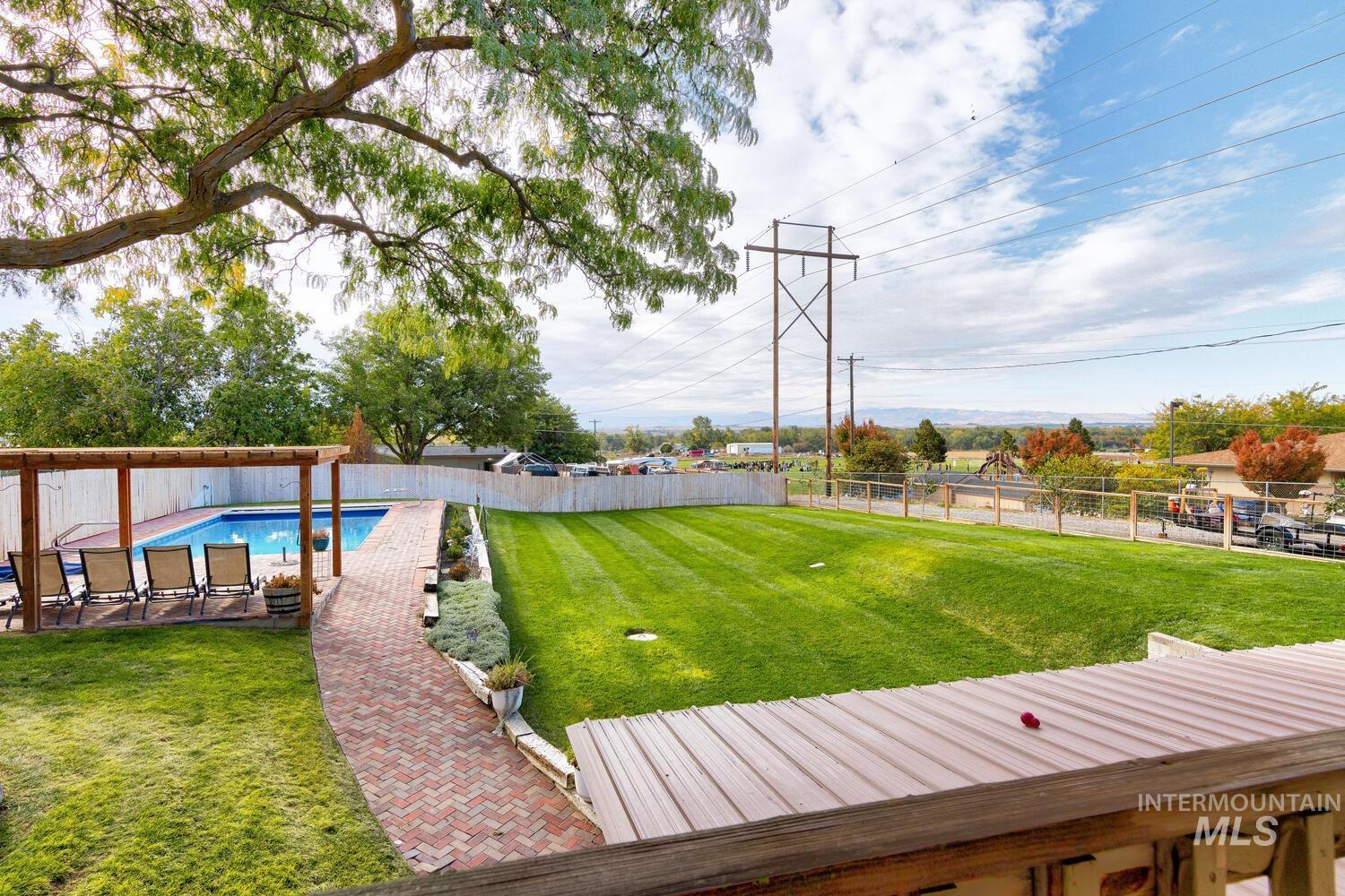 Fenced backyard with a patio area