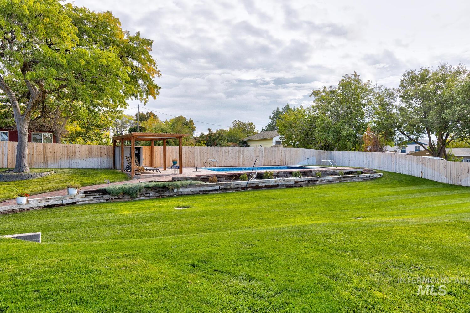 Fenced backyard featuring a patio area