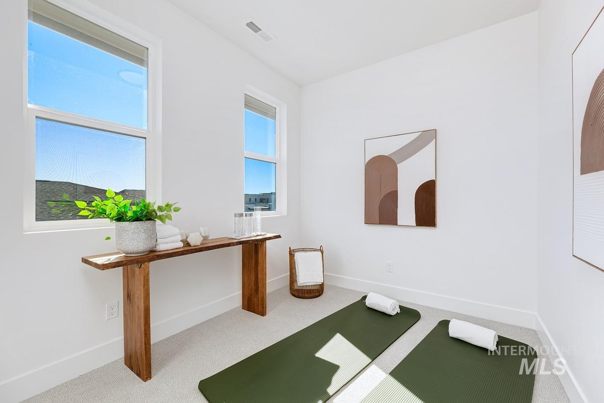 Unfurnished office with carpet flooring and baseboards