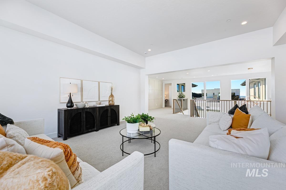 Carpeted living room featuring recessed lighting