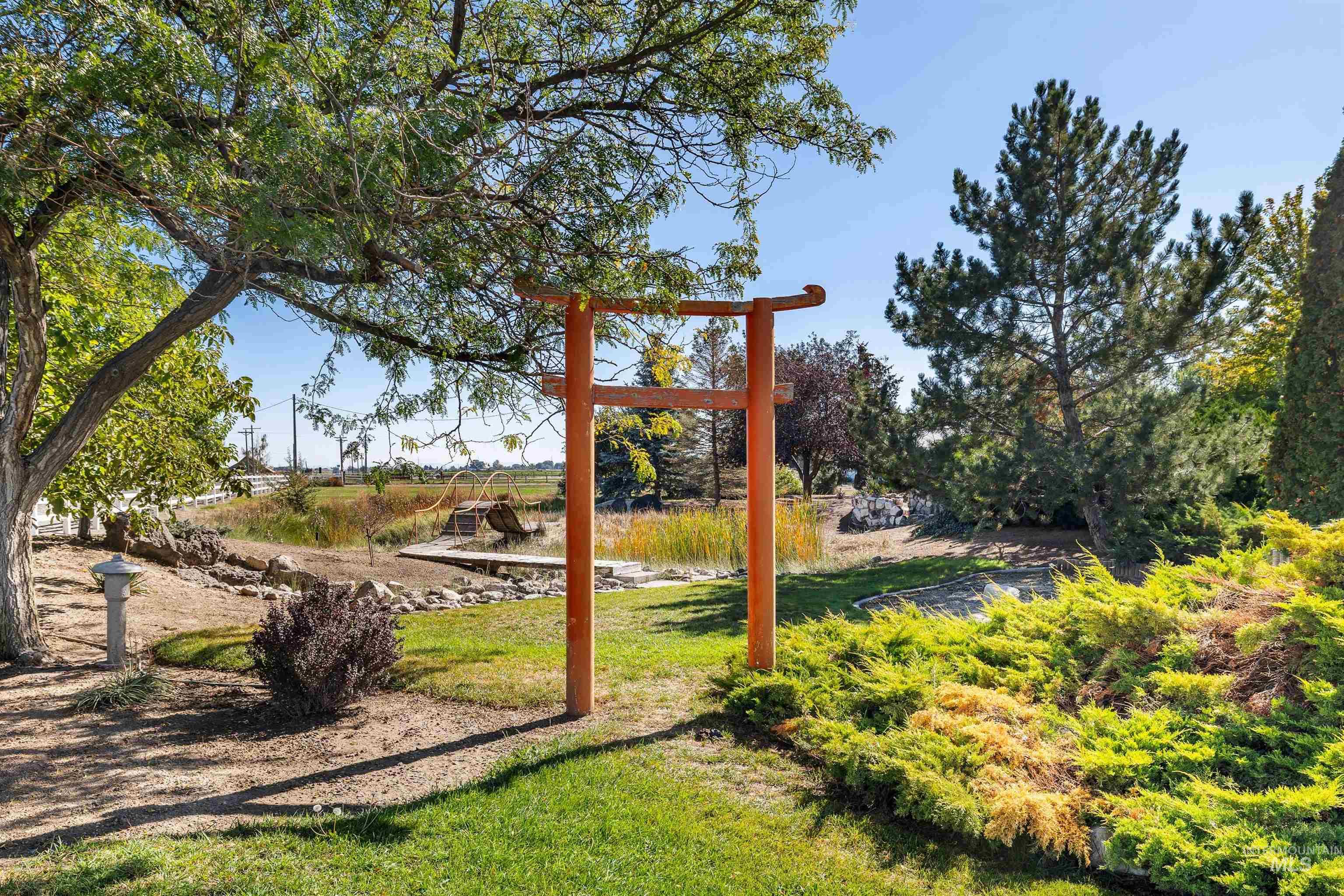 View of jungle gym featuring a lawn
