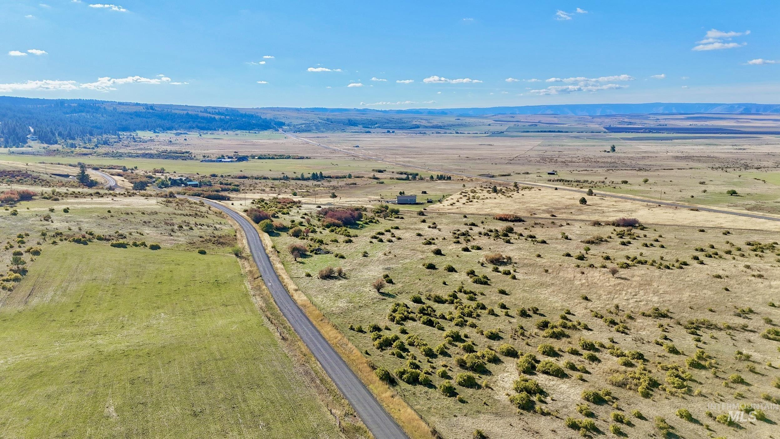 Overview of rural landscape with a mountain backdrop