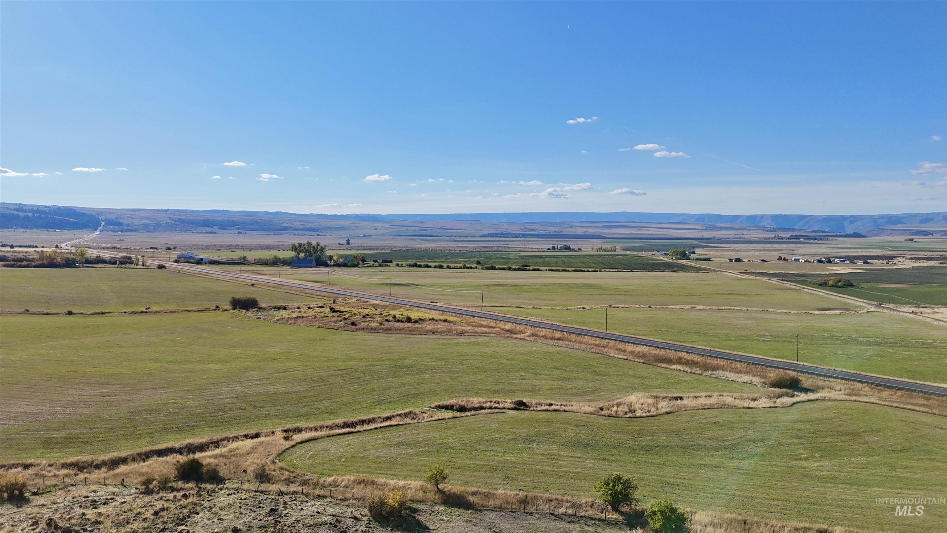 Overview of rural landscape featuring a mountainous background
