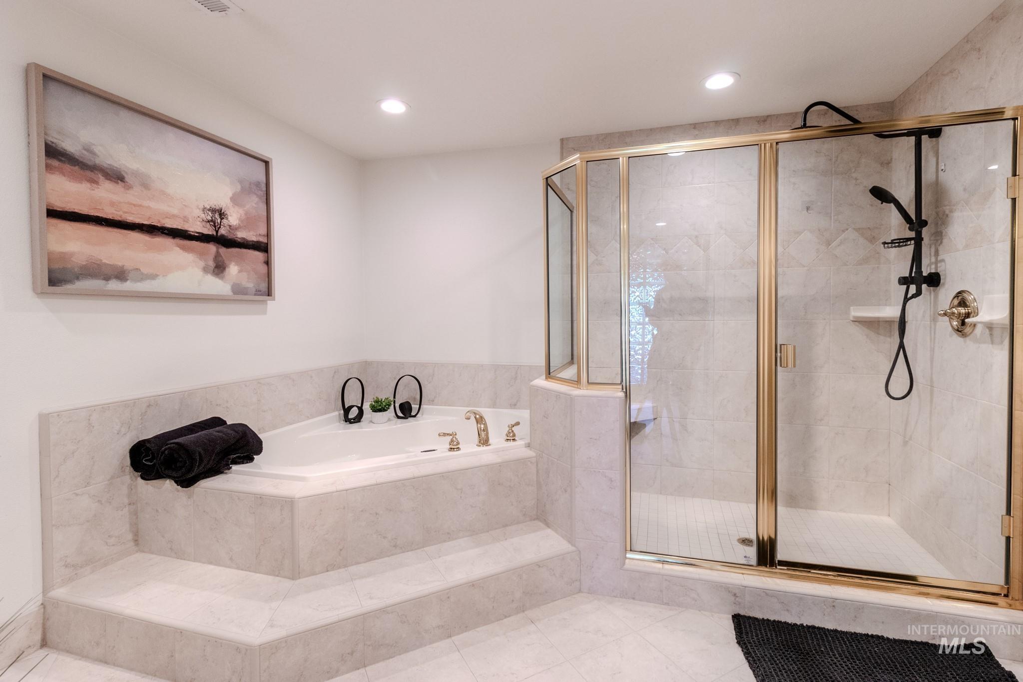 Full bathroom with a garden tub, a stall shower, tile patterned floors, and recessed lighting