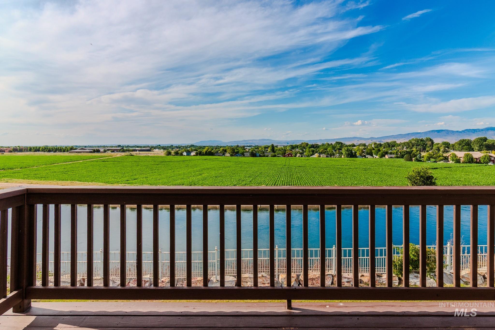 Deck featuring a yard and a water and mountain view