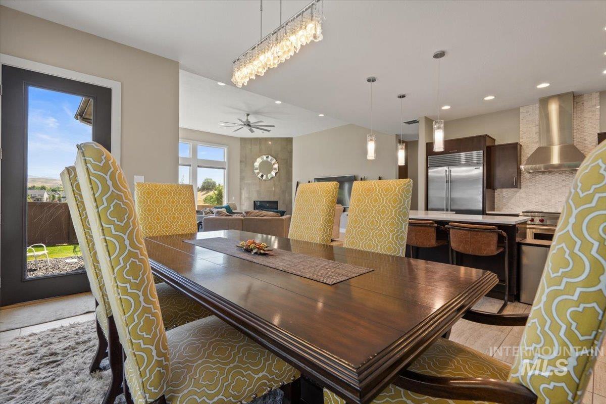 Dining room featuring light wood-style floors, recessed lighting, and a ceiling fan