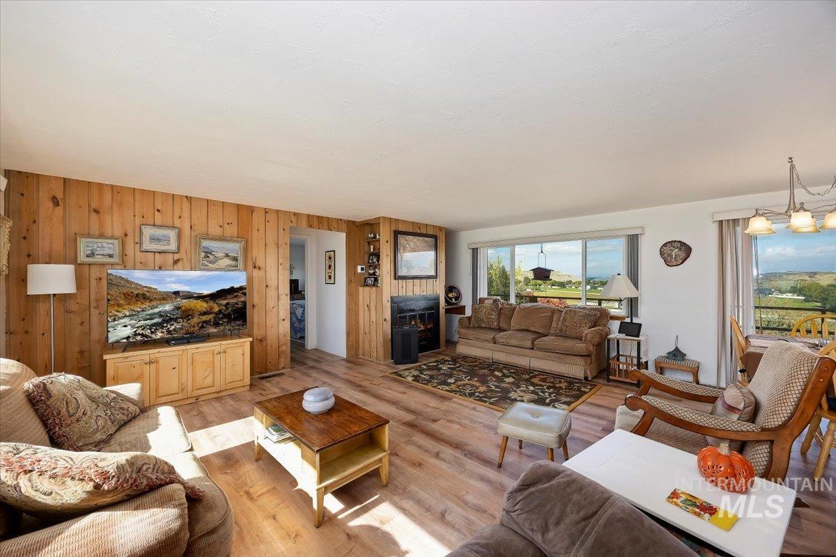 Living area featuring wood walls and wood finished floors