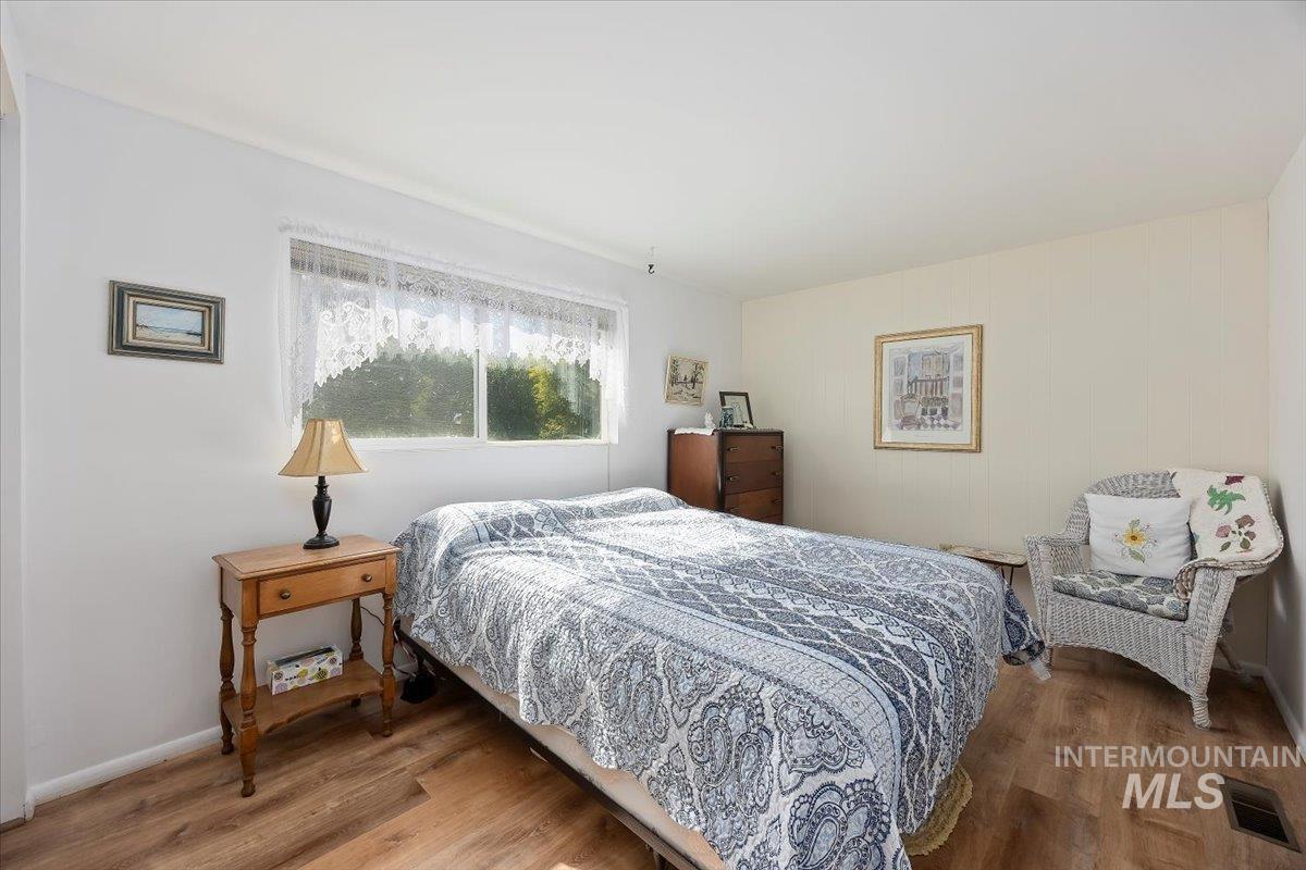 Bedroom with wood finished floors