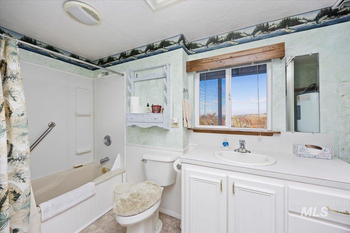 Bathroom, vanity, shower / bath combo.
