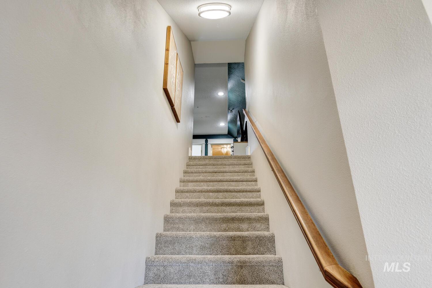 Stairway featuring recessed lighting