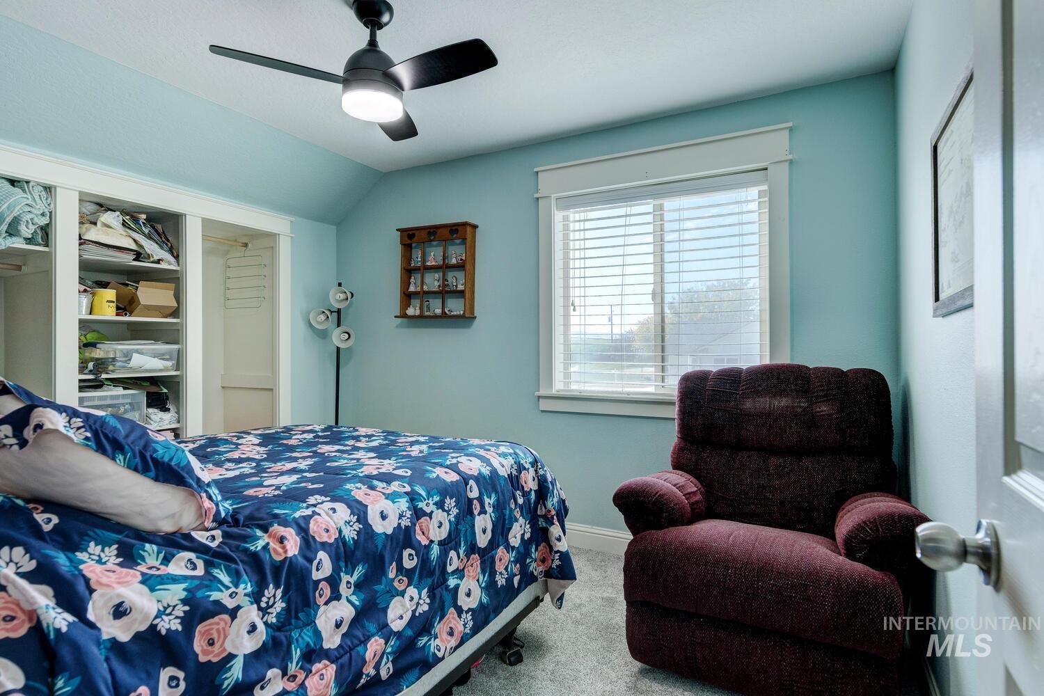 Bedroom featuring carpet flooring and ceiling fan