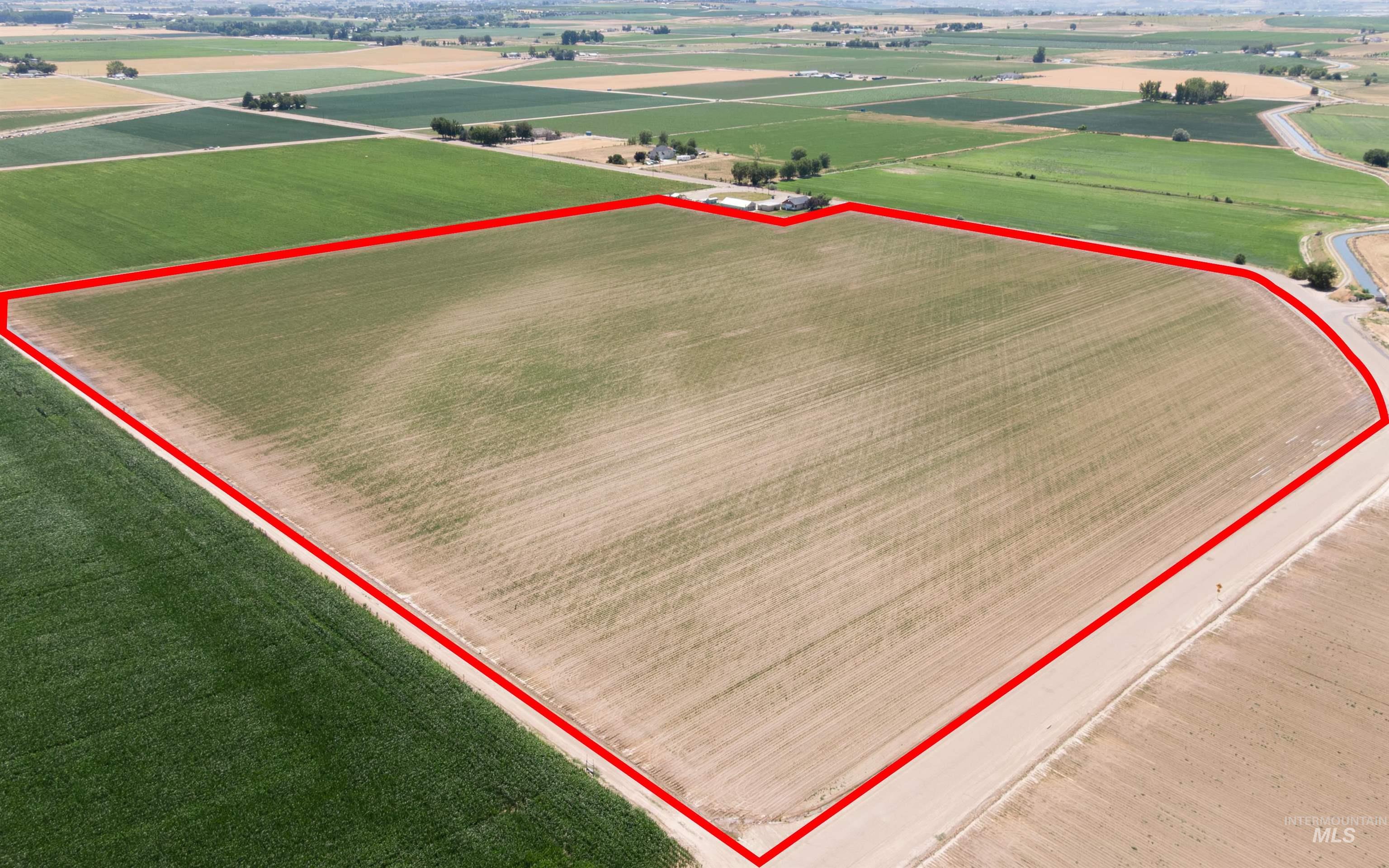 View of rural area featuring abundant farmland and property parcel outlined