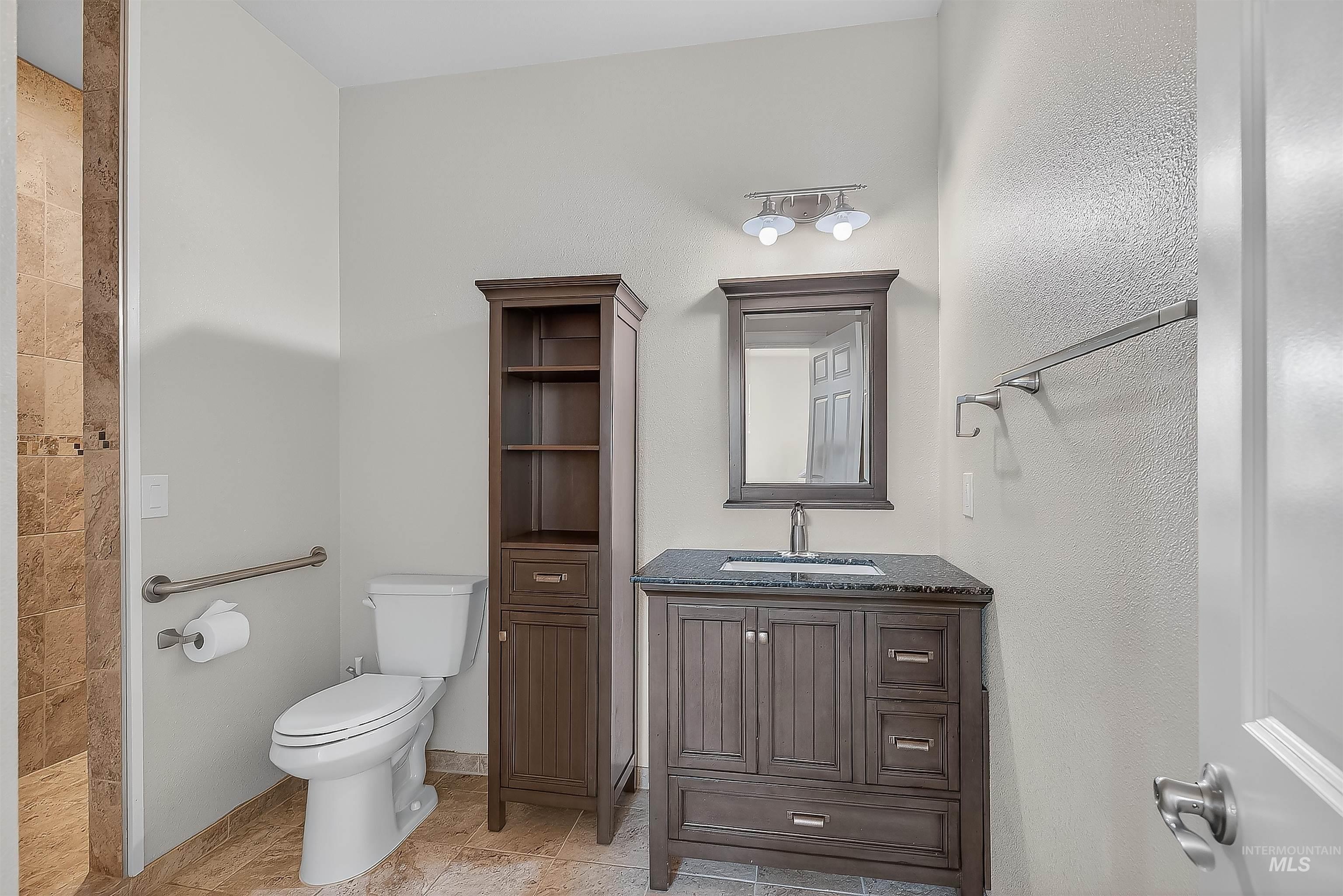 Full bath with vanity and toilet
