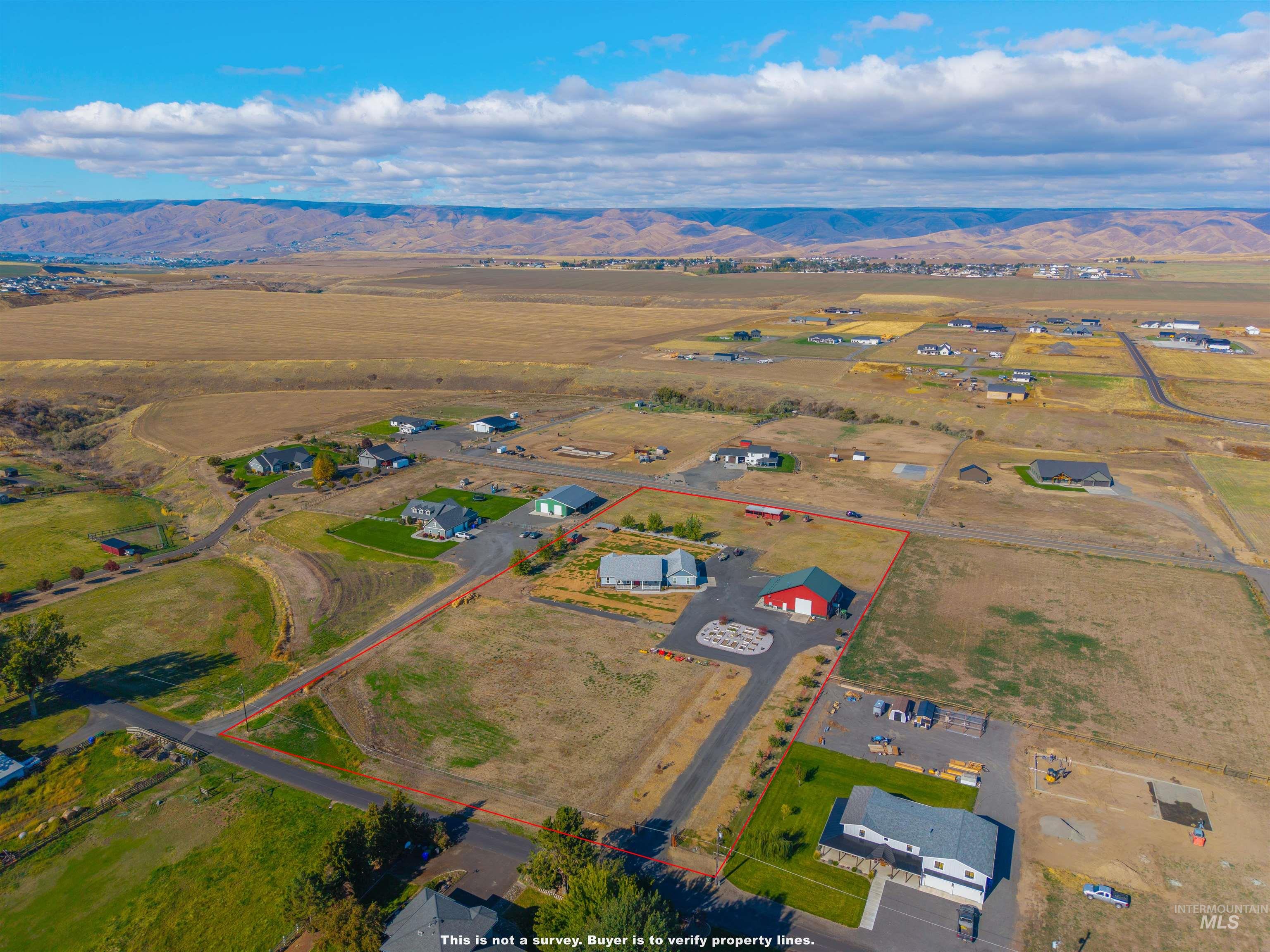 Aerial view of sparsely populated area with a mountainous background
