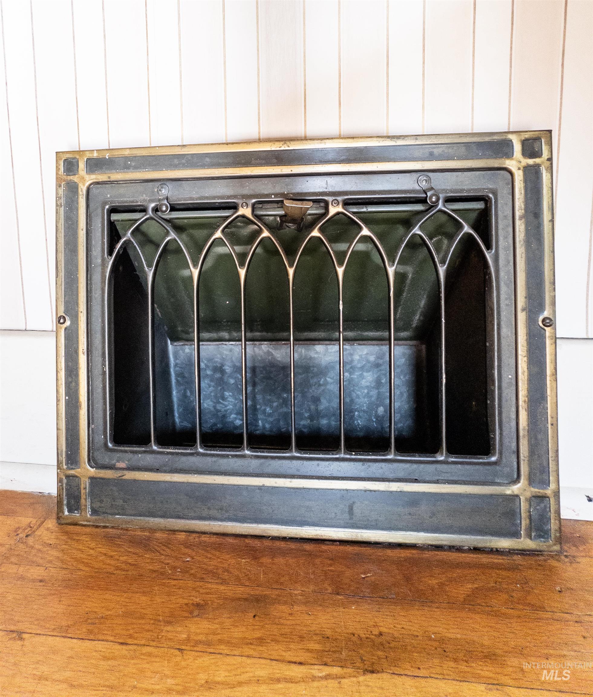 Detailed view of heating unit and wood finished floors