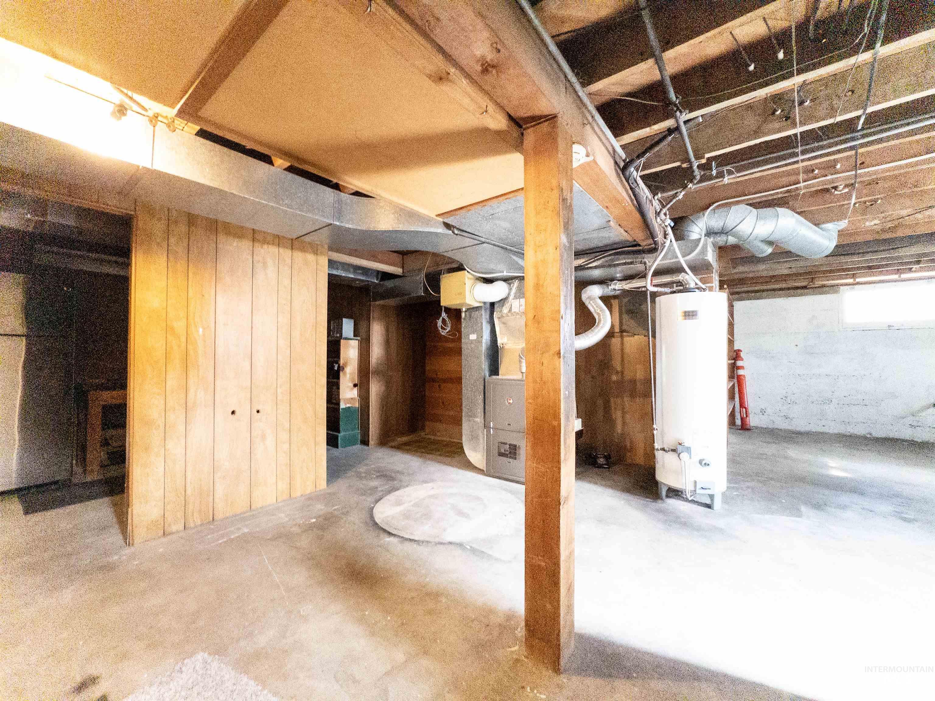 Below grade area featuring gas water heater