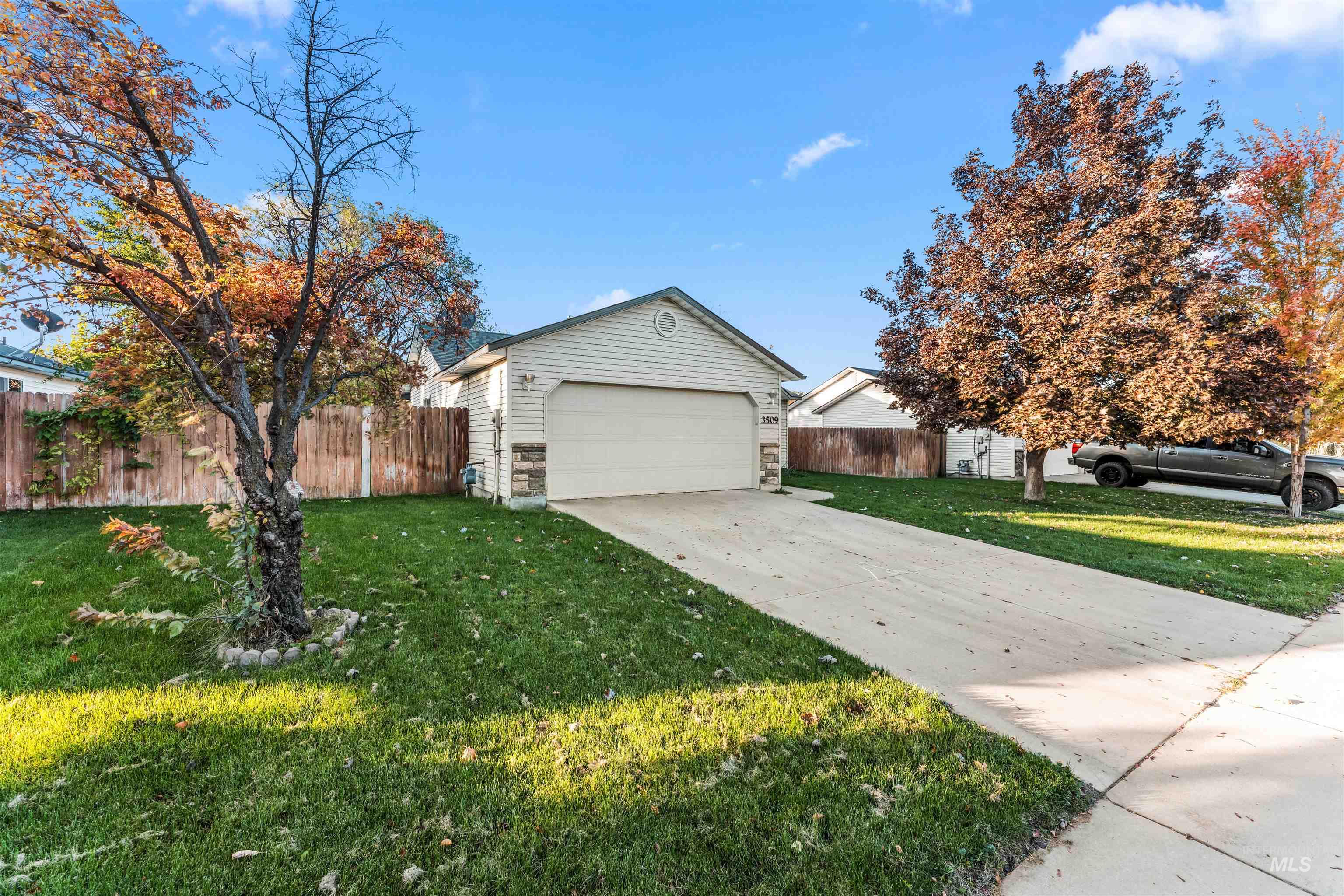 View of home's exterior featuring a garage and concrete driveway