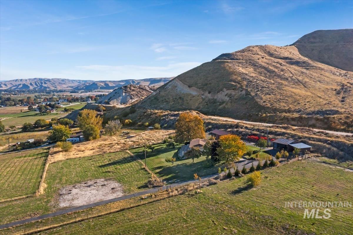 View of mountain backdrop featuring rural landscape