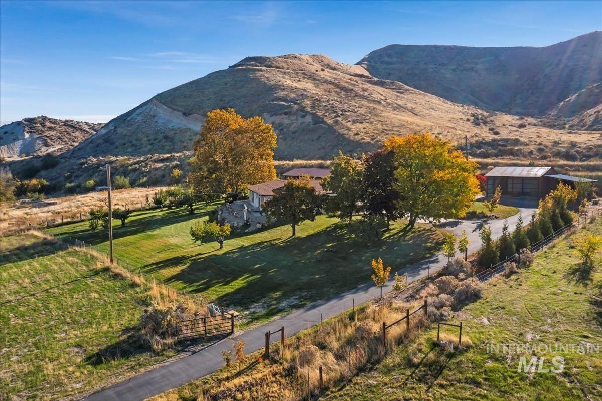 View of mountain backdrop with rural landscape