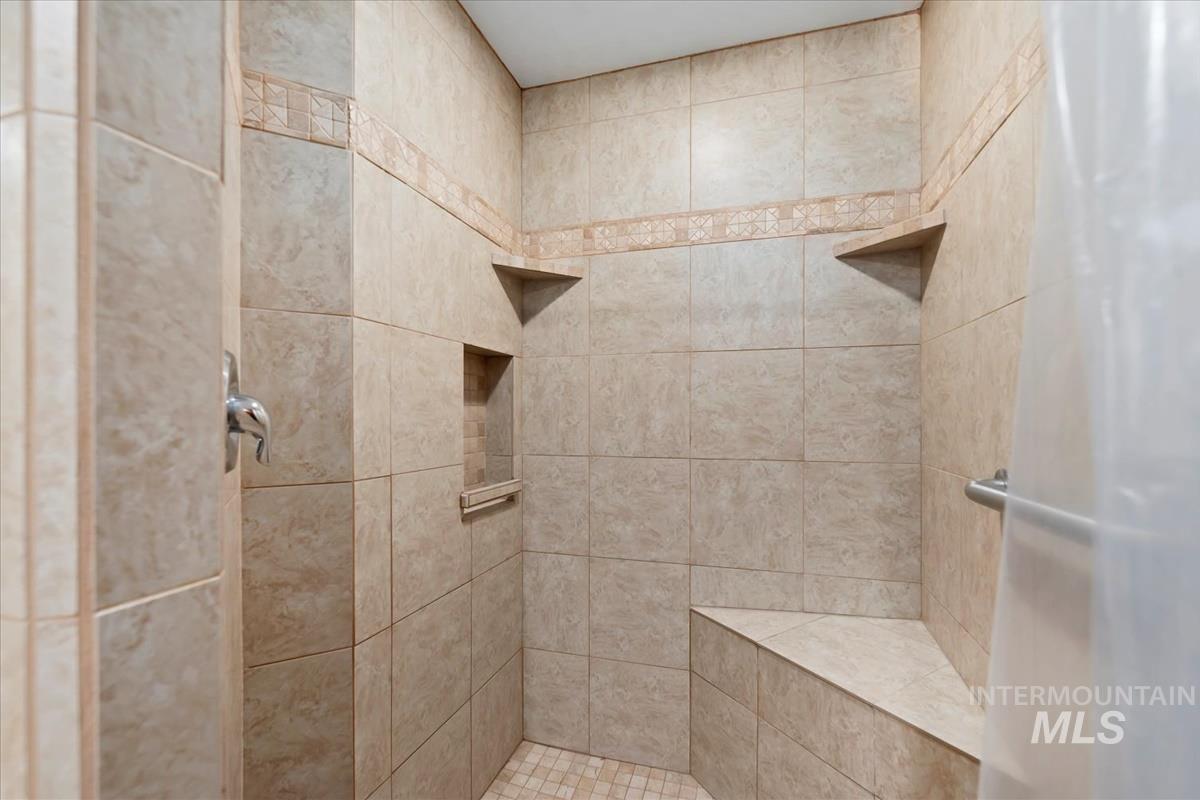 Bathroom featuring tiled shower