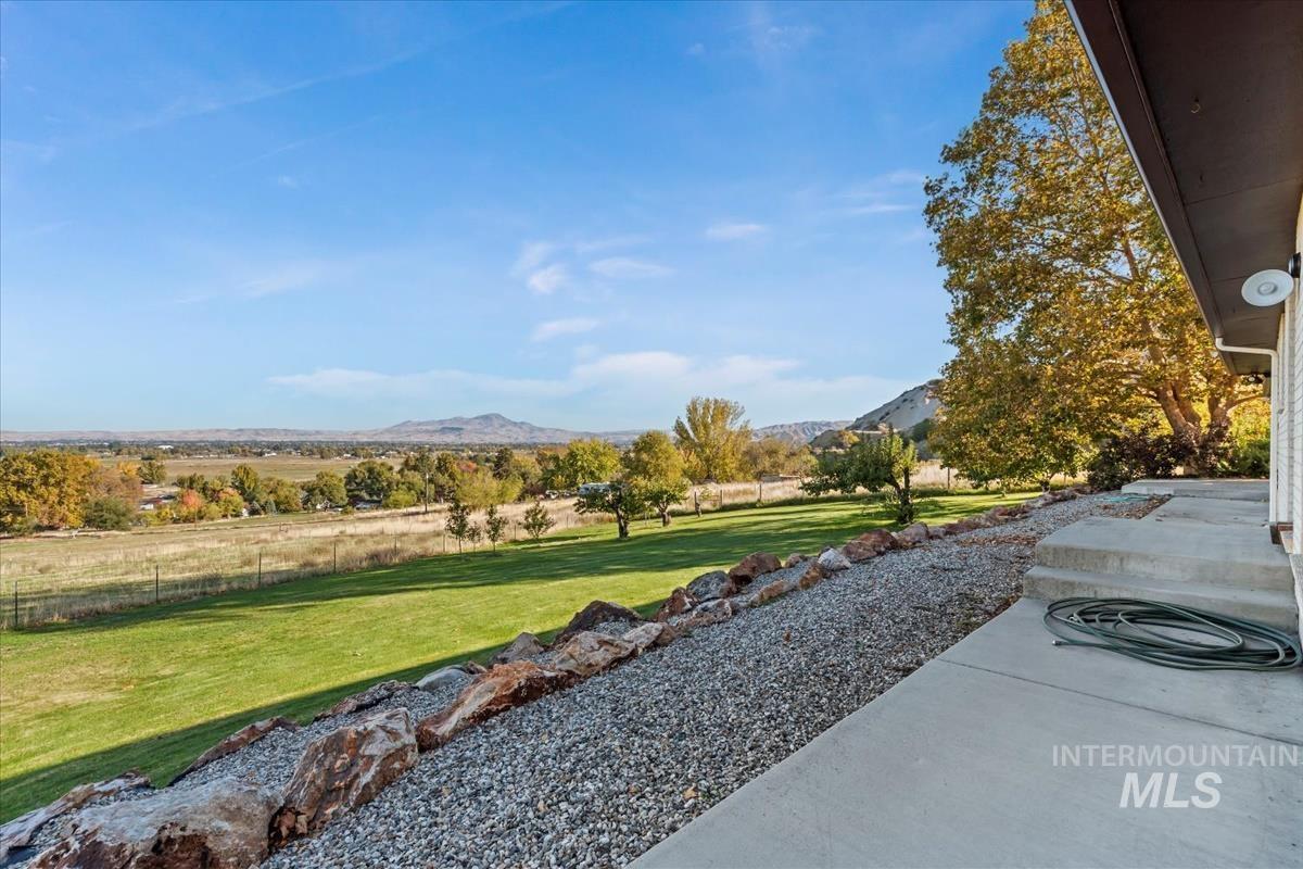 View of yard with a mountain view and a view of countryside