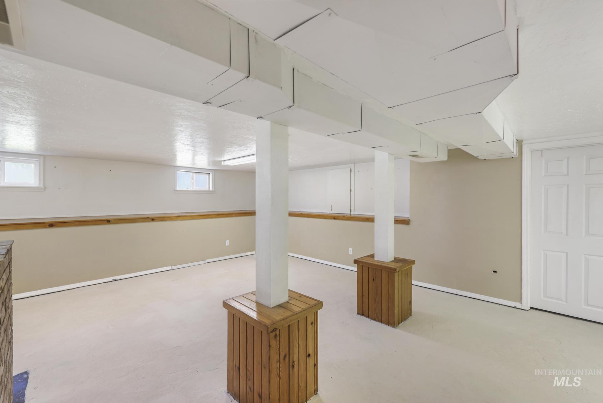 Basement featuring baseboards