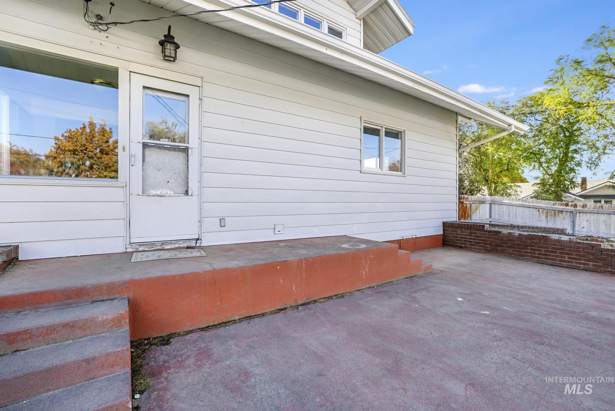Rear view of property featuring a patio