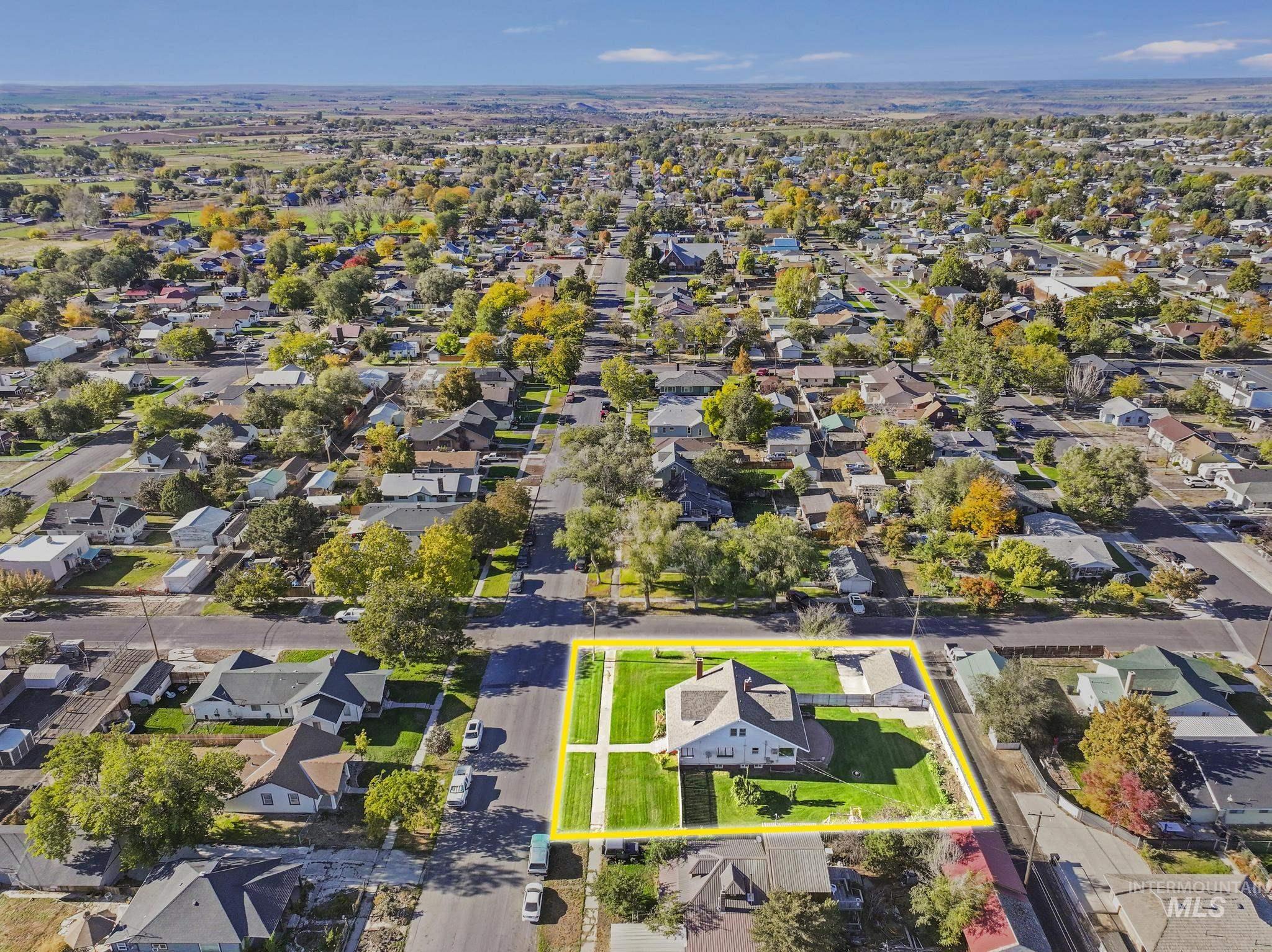 Aerial view of residential area with property parcel outlined