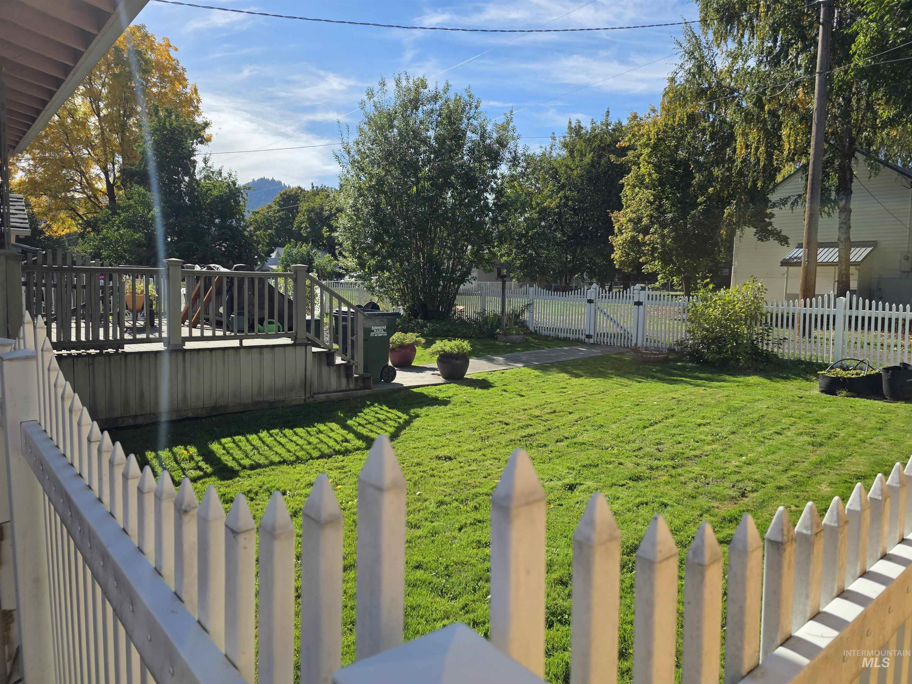 Fenced yard with a wooden deck