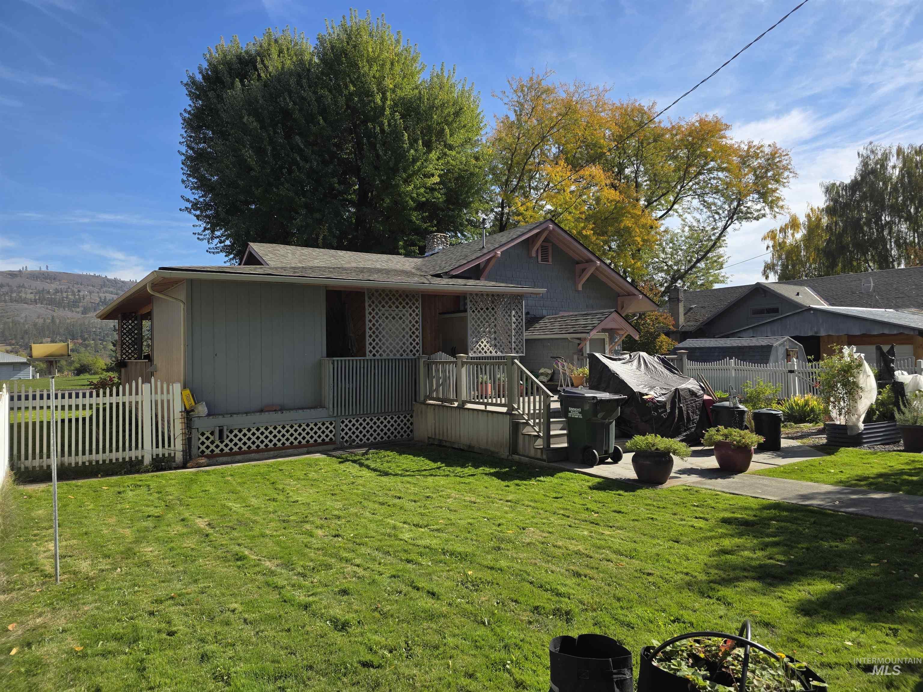 Back of property with a deck