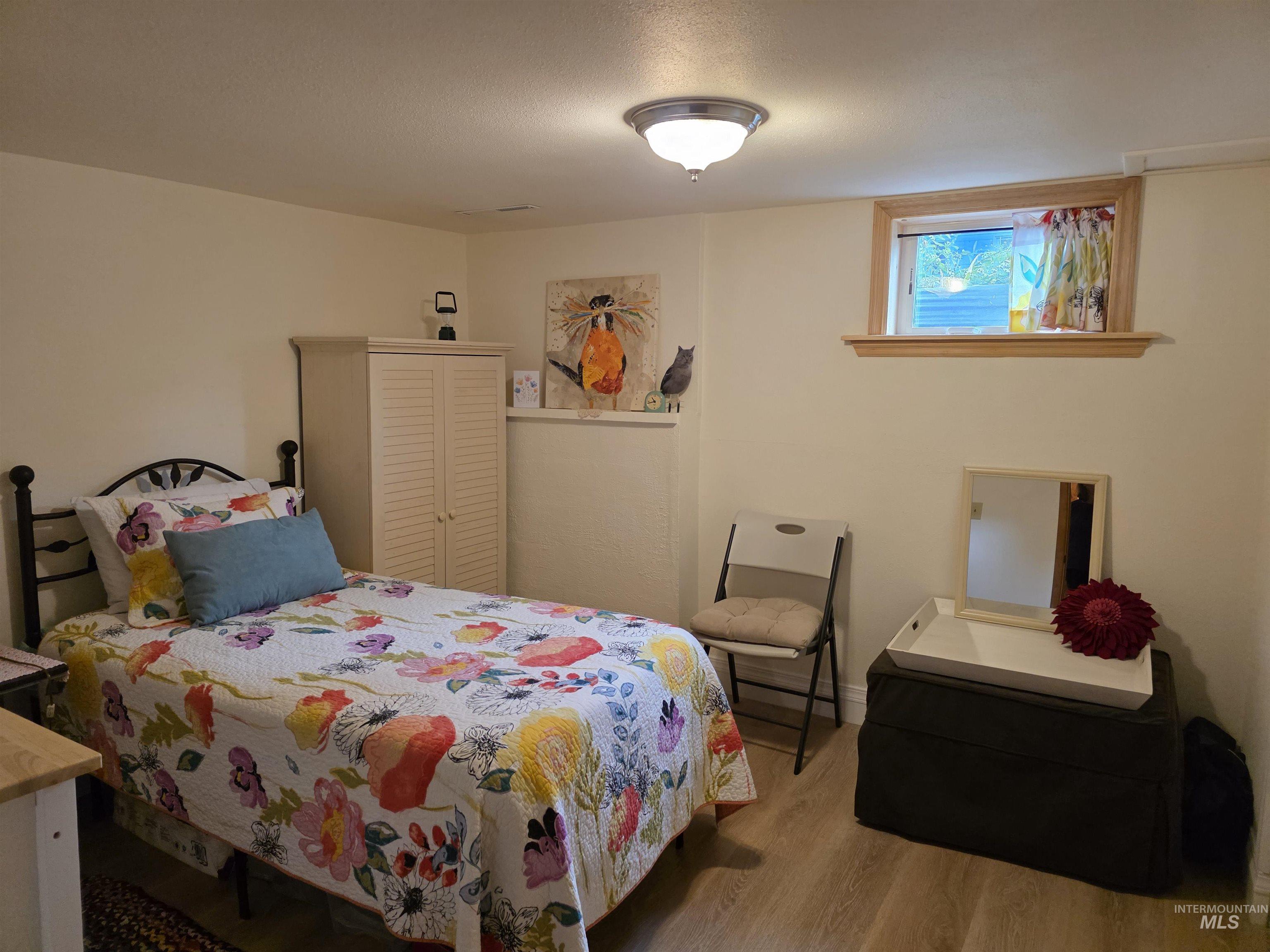 Bedroom featuring wood finished floors