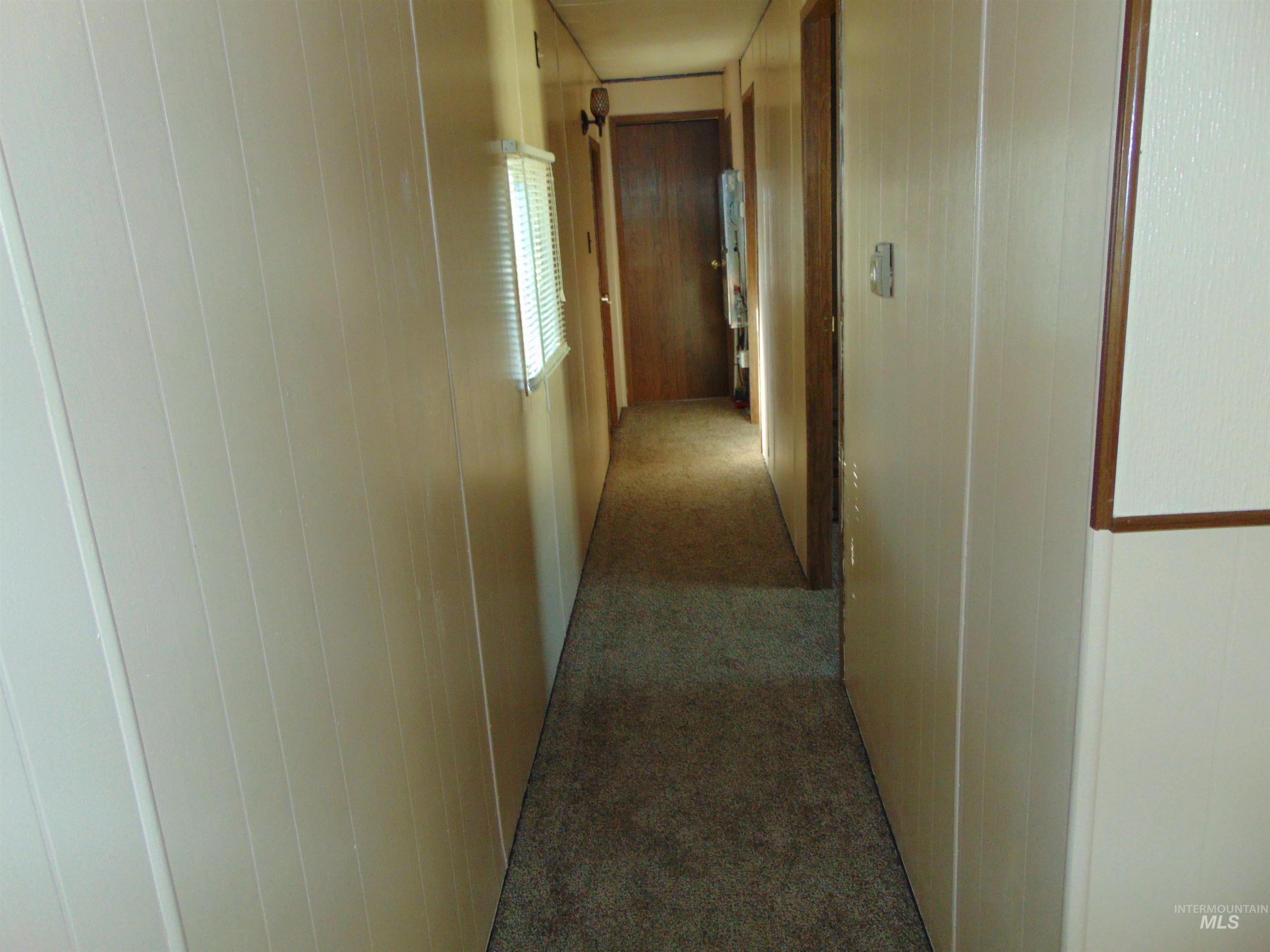 Hallway with carpet flooring