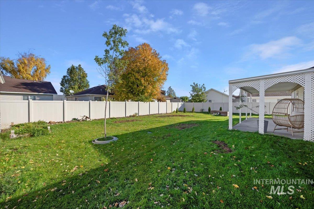 Fenced backyard featuring a patio area