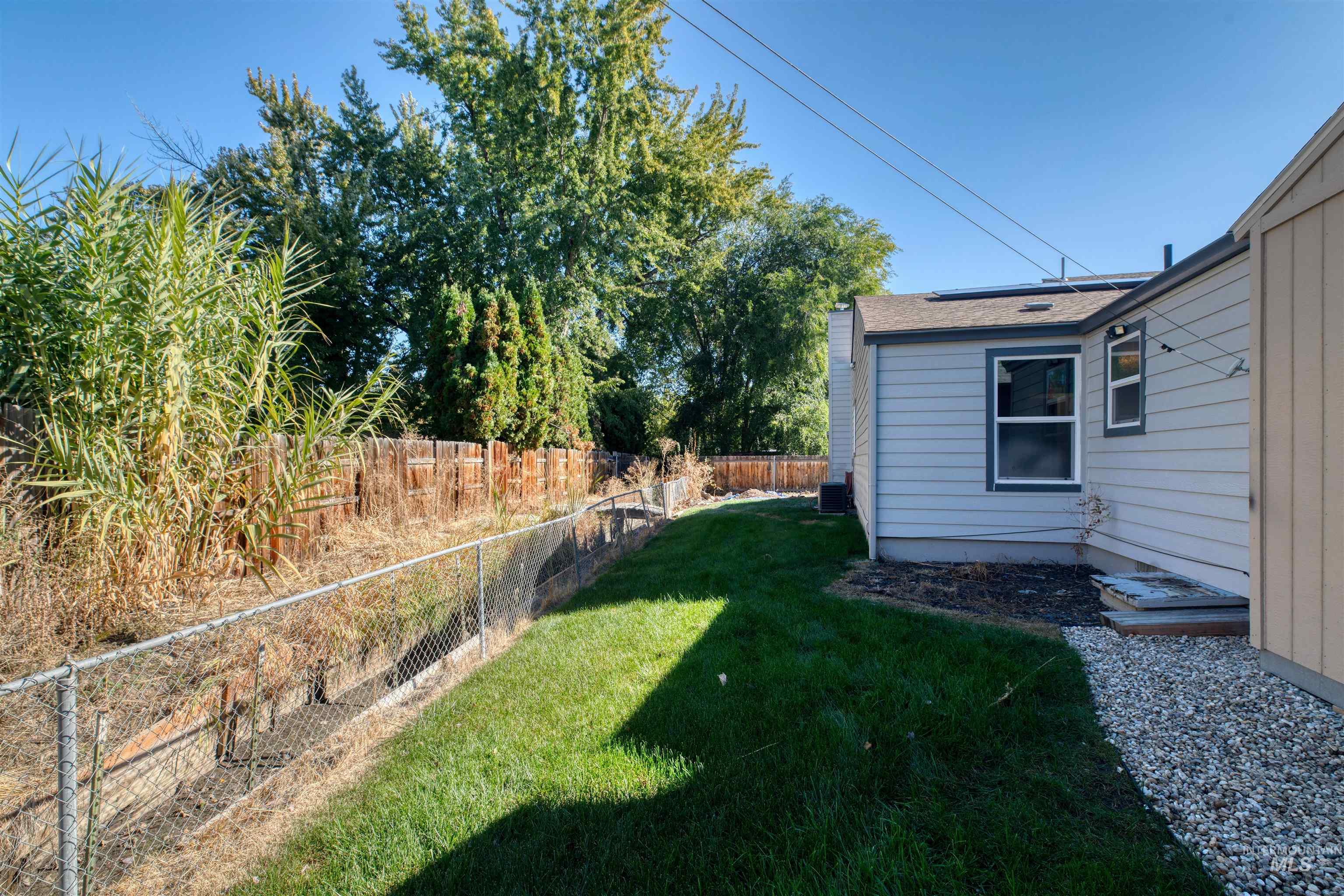 View of fenced backyard