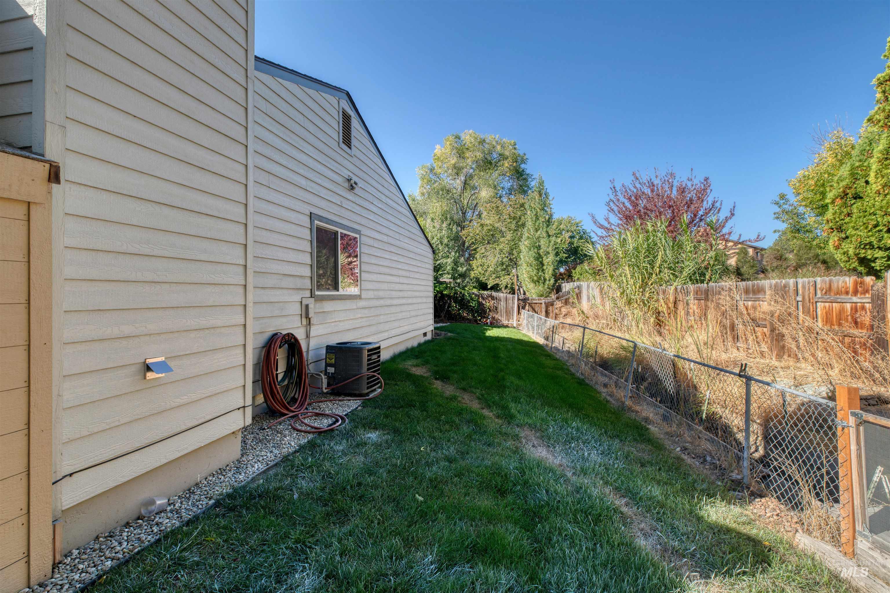 View of fenced backyard