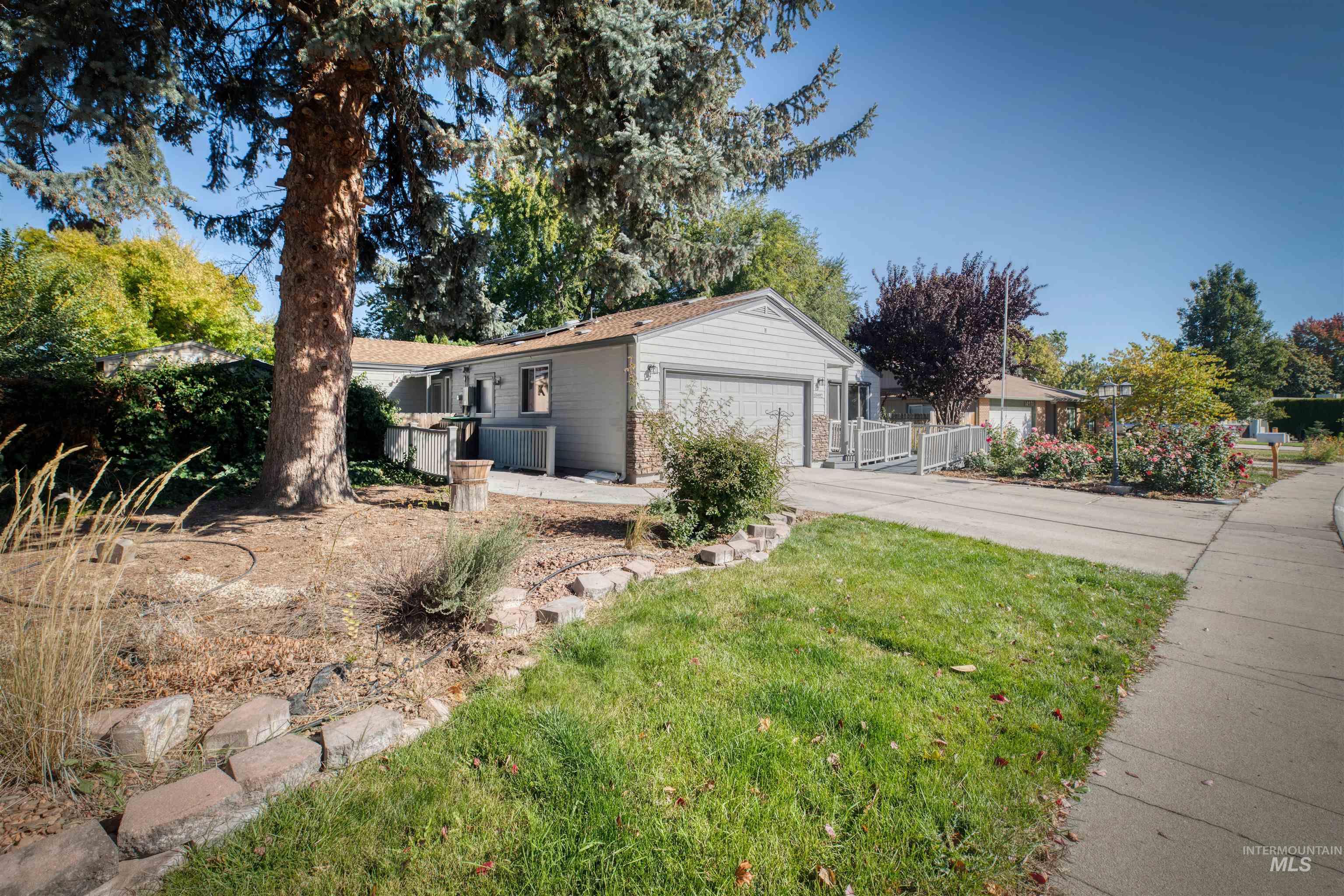 View of front of home featuring driveway and an attached garage